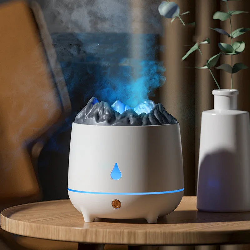 White volcano-shaped ultrasonic humidifier with USB cable on a table