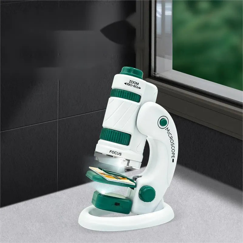 Portable white and green plastic microscope set with specimen slides for educational science exploration.
