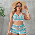 Women's blue briefs style swimsuit with hollow out strap design and split side detail