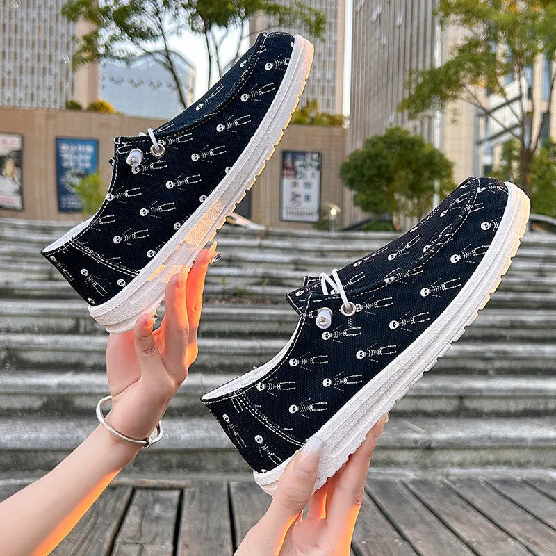 Women's black canvas low-top soft sole shoes on display, showing side view, plus size range 37-42