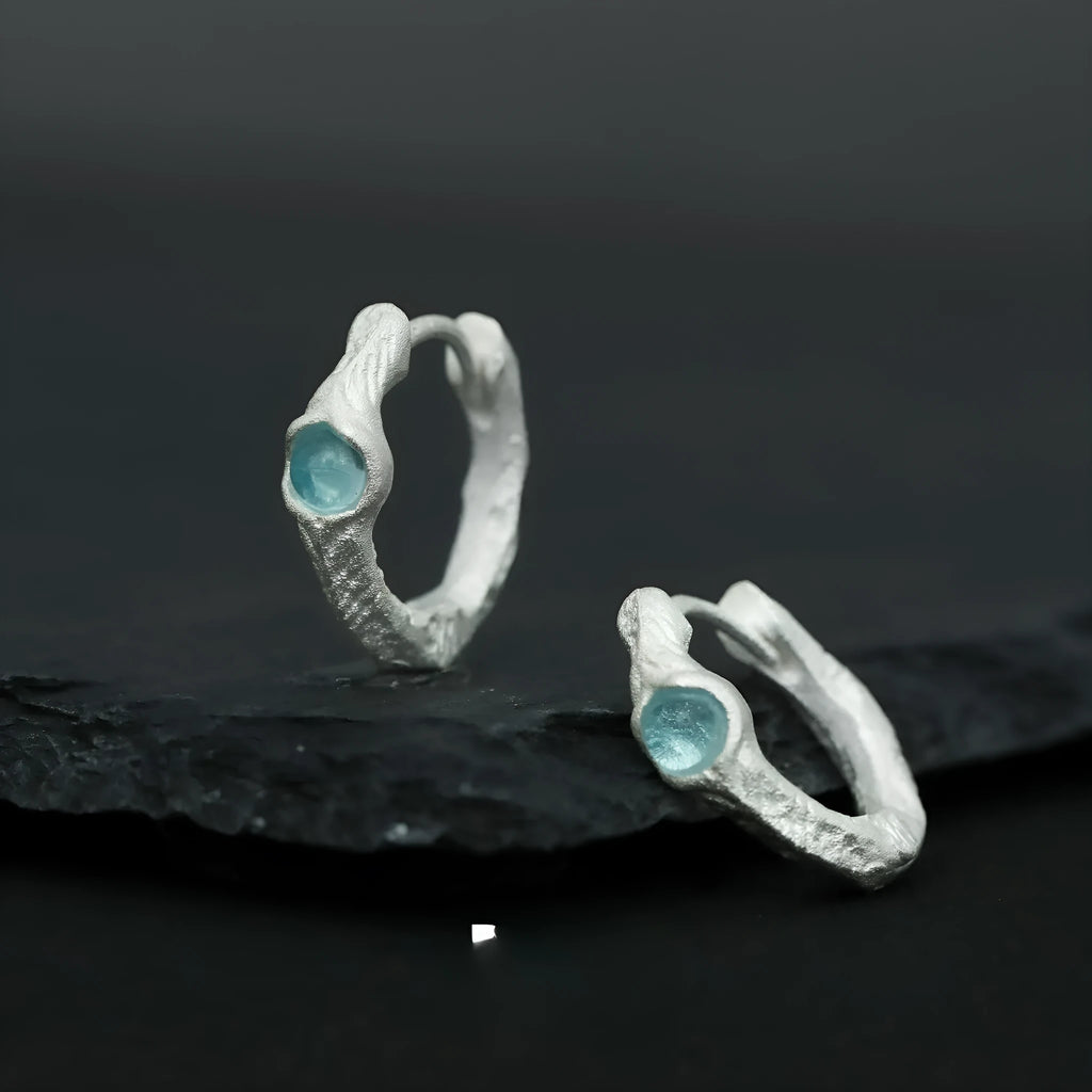 Female geometry round ear clip in burnt silver finish made from 925 silver