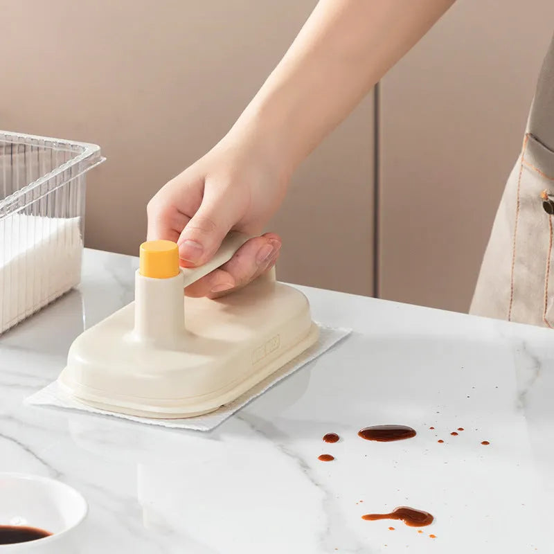 Magic Brush cleaning tool with plastic handle and stack of 50 white disposable non-woven fabric rags