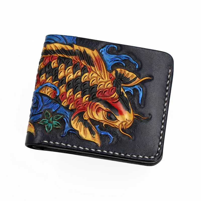 Men's hand-carved short leather wallet in blue, showing textured detail and compact size next to a card for scale.