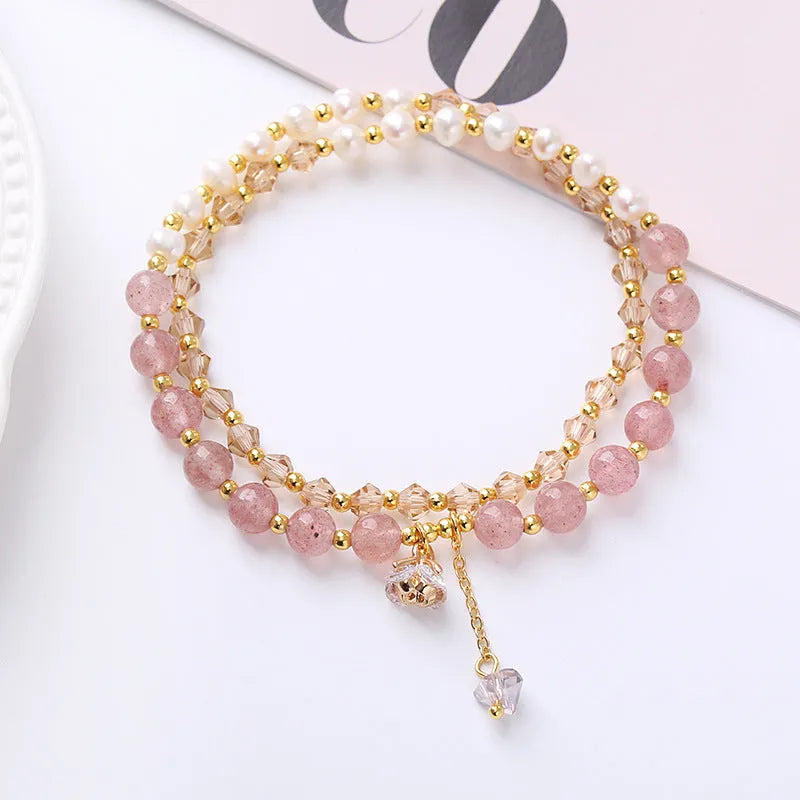 Natural freshwater pearl and crystal double ring bracelet in strawberry quartz, amethyst, or aquamarine.