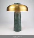 Modern alloy desk lamp with a rechargeable battery and touch-sensitive dimming switch on a wooden desk