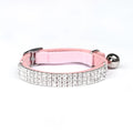 A red velvet cat collar with sparkling rhinestones, showing its 1 cm width and adjustable buckle.