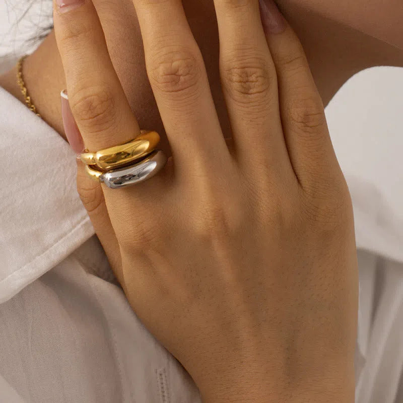 18K gold-plated double-arc geometric stainless steel ring for women on white background