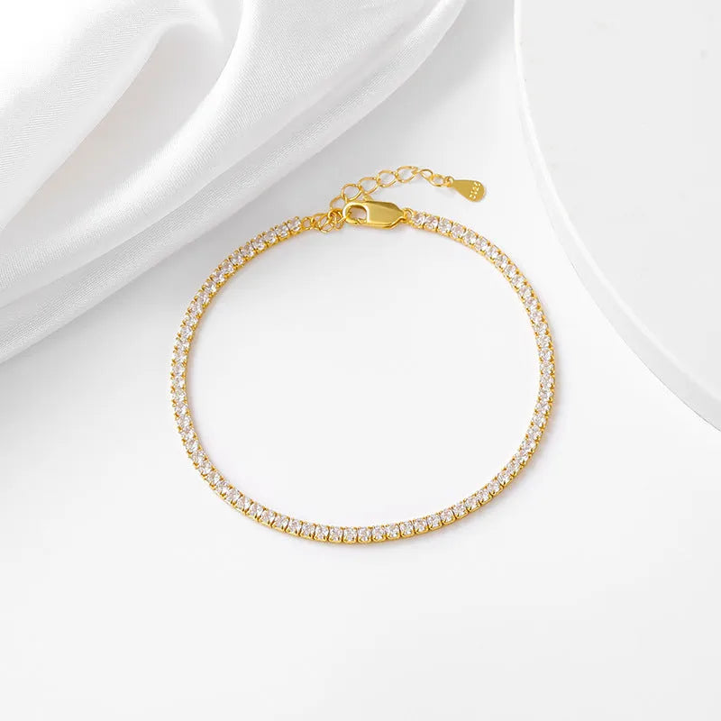 Geometric silver bracelet with zircon inlay, white gold finish, 3mm stone on a flat surface