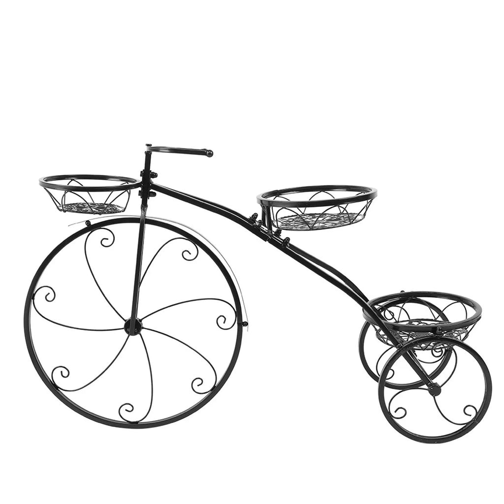 Black wrought iron tricycle plant stand with three round basket tiers and decorative scroll wheels