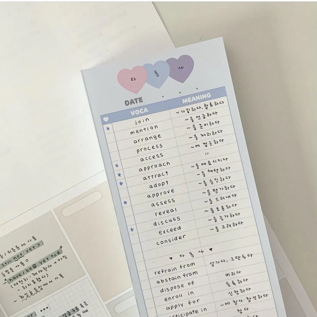 Vertical half-B5 notepad with English words, shown in pink, purple, and blue cover colour options.