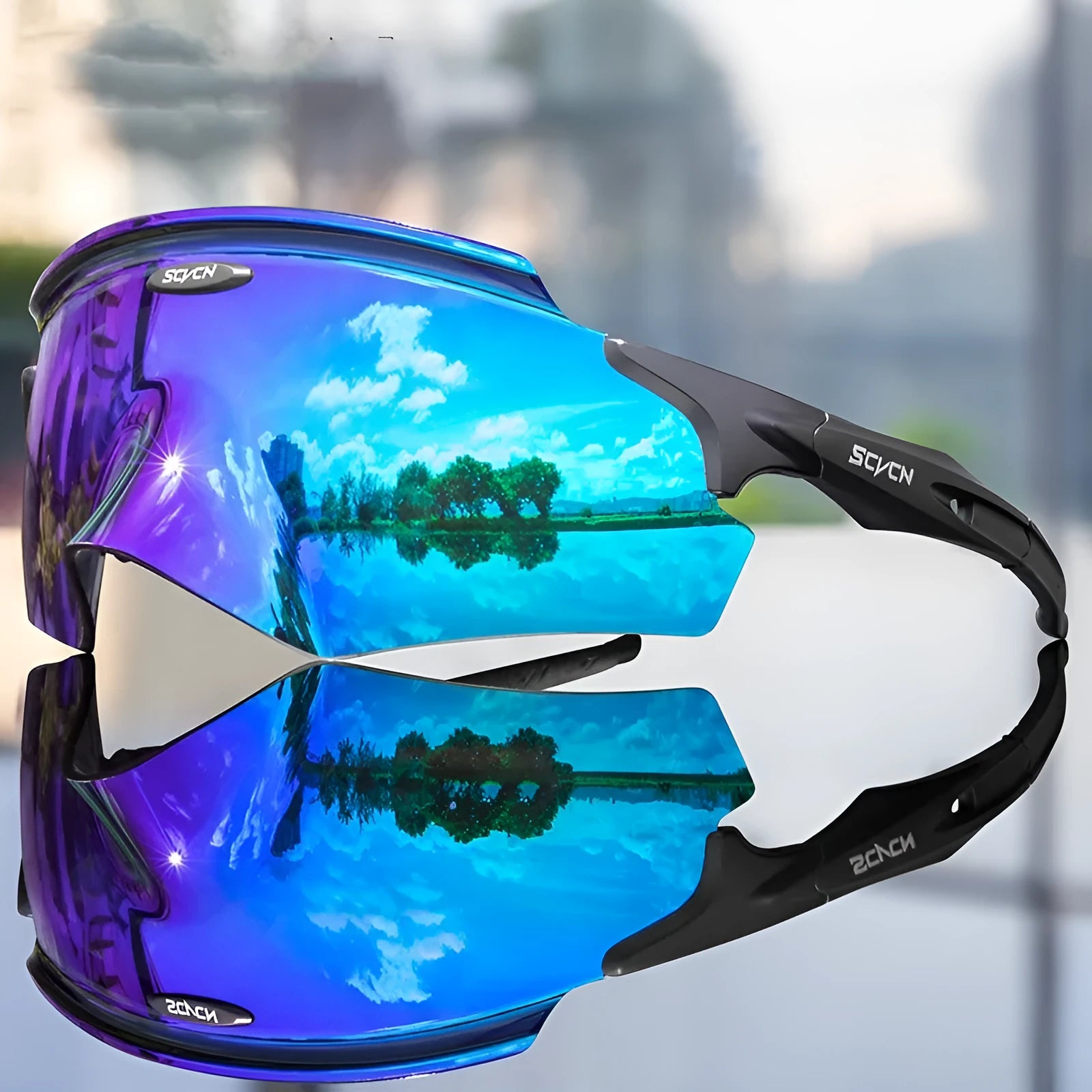 Frameless windproof sports goggles with a colourful one-piece lens on a neutral background.