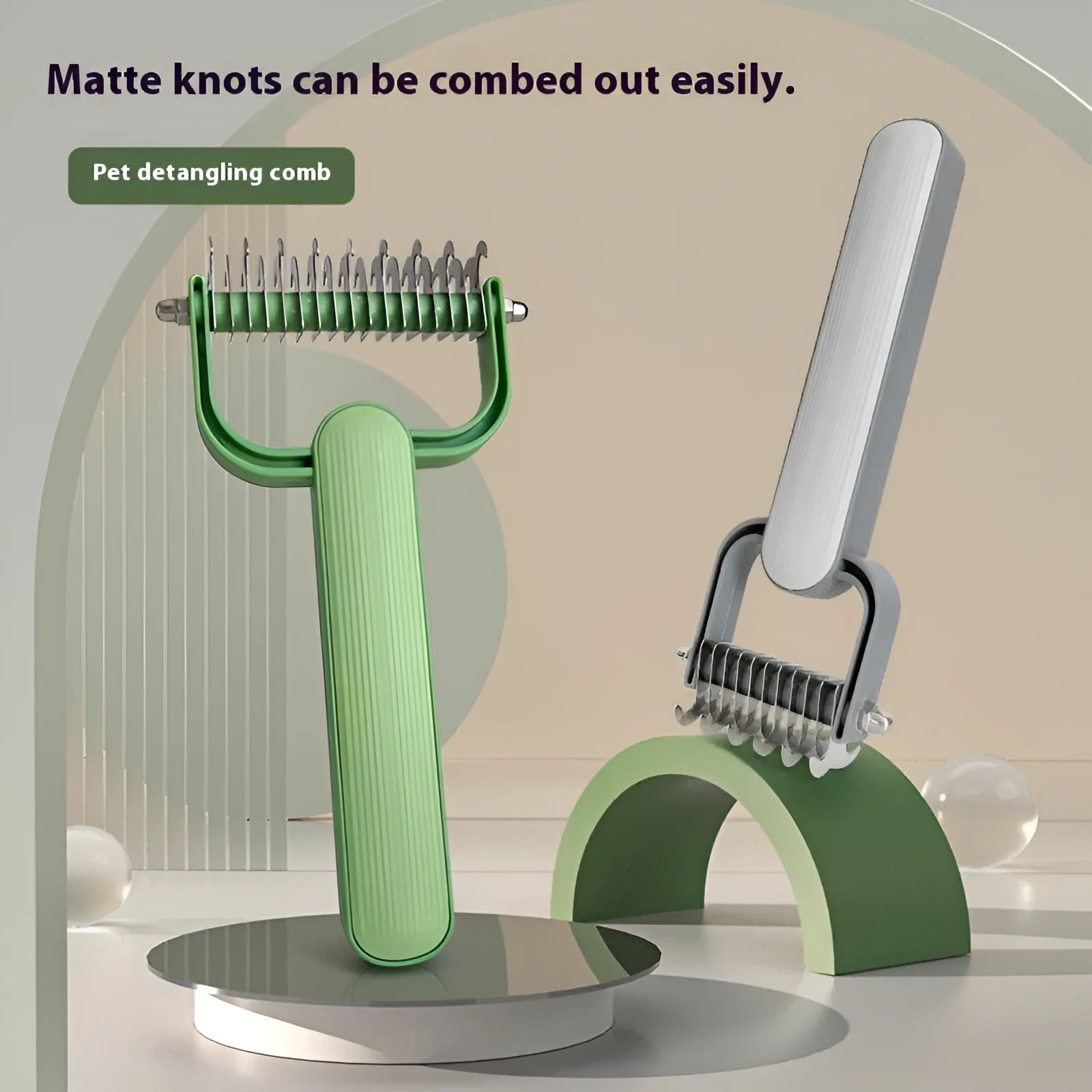 Green and grey pet hair unknotting comb for dogs with stainless steel teeth.