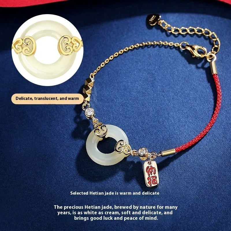 Women's Chinese style Hetian jade and sterling silver jewellery set showing bracelet, necklace, and earrings.