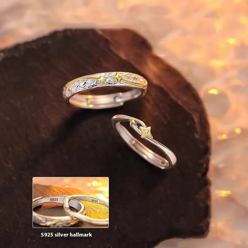 Pair of copper electroplated meteor shower star couple rings with adjustable opening on a flat surface