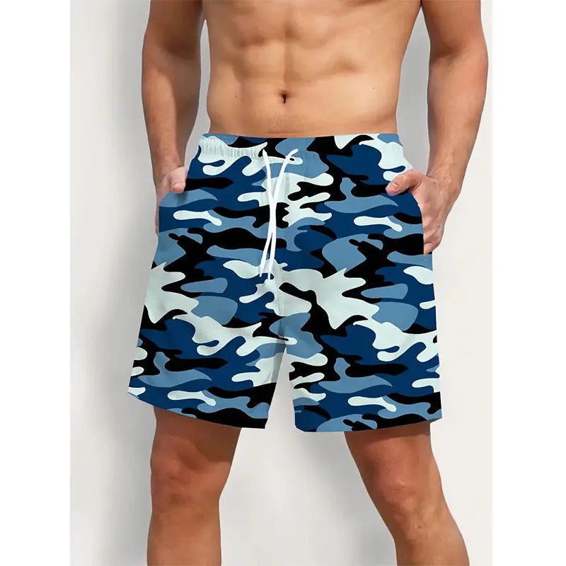 Colourful printed men's beach shorts with an elastic waistband on a neutral background.