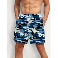 Colourful printed men's beach shorts with an elastic waistband on a neutral background.