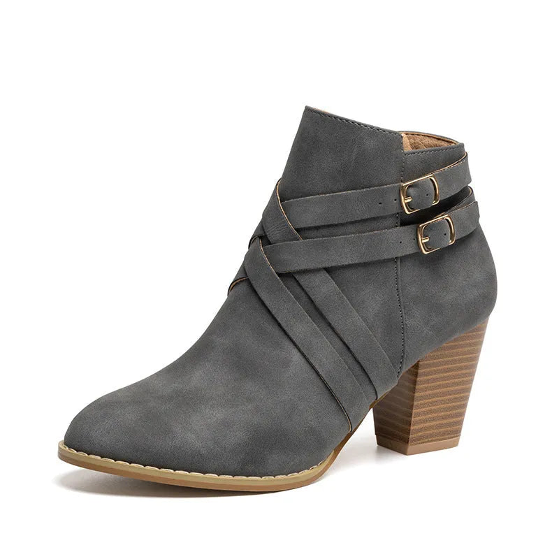 Grey plus size ankle boot with a 7cm chunky heel, side zipper, and buckle detail on a plain toe.