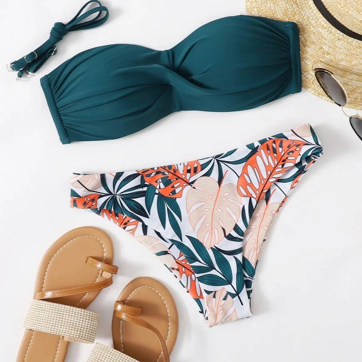Green hard cup push up bikini swimsuit set with briefs bottom on a mannequin.