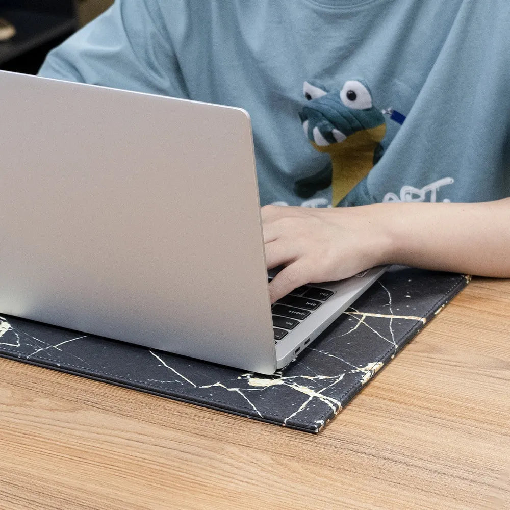 Durable tablet pad for printing in black, blue, green, and black gold colour options on a desk.