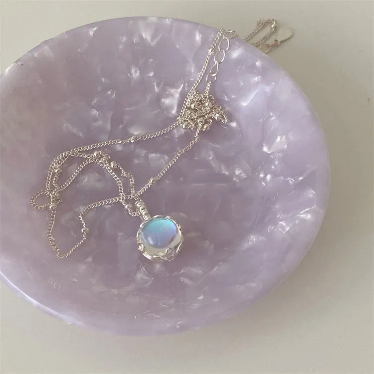 925 silver ornamental stone necklace with round geometric pendant on a curb chain.