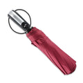 Black automatic triple folding umbrella with steel ribs and a rubber handle.