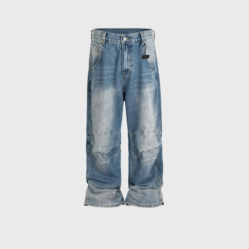 Men's washed light blue baggy jeans with a straight-leg cut and zip fly.