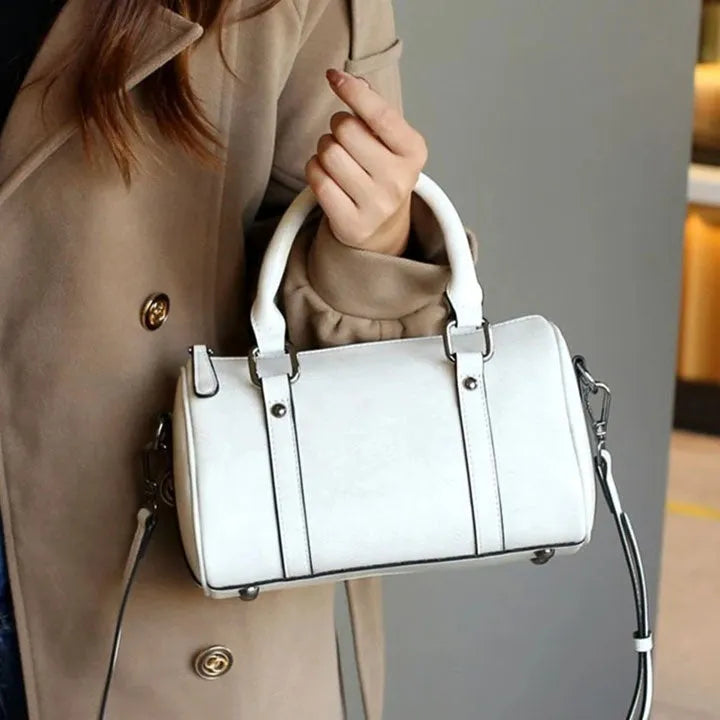 Cortex lady casual zip crossbody bag in top grain leather, cylindrical shape, shown in available colours