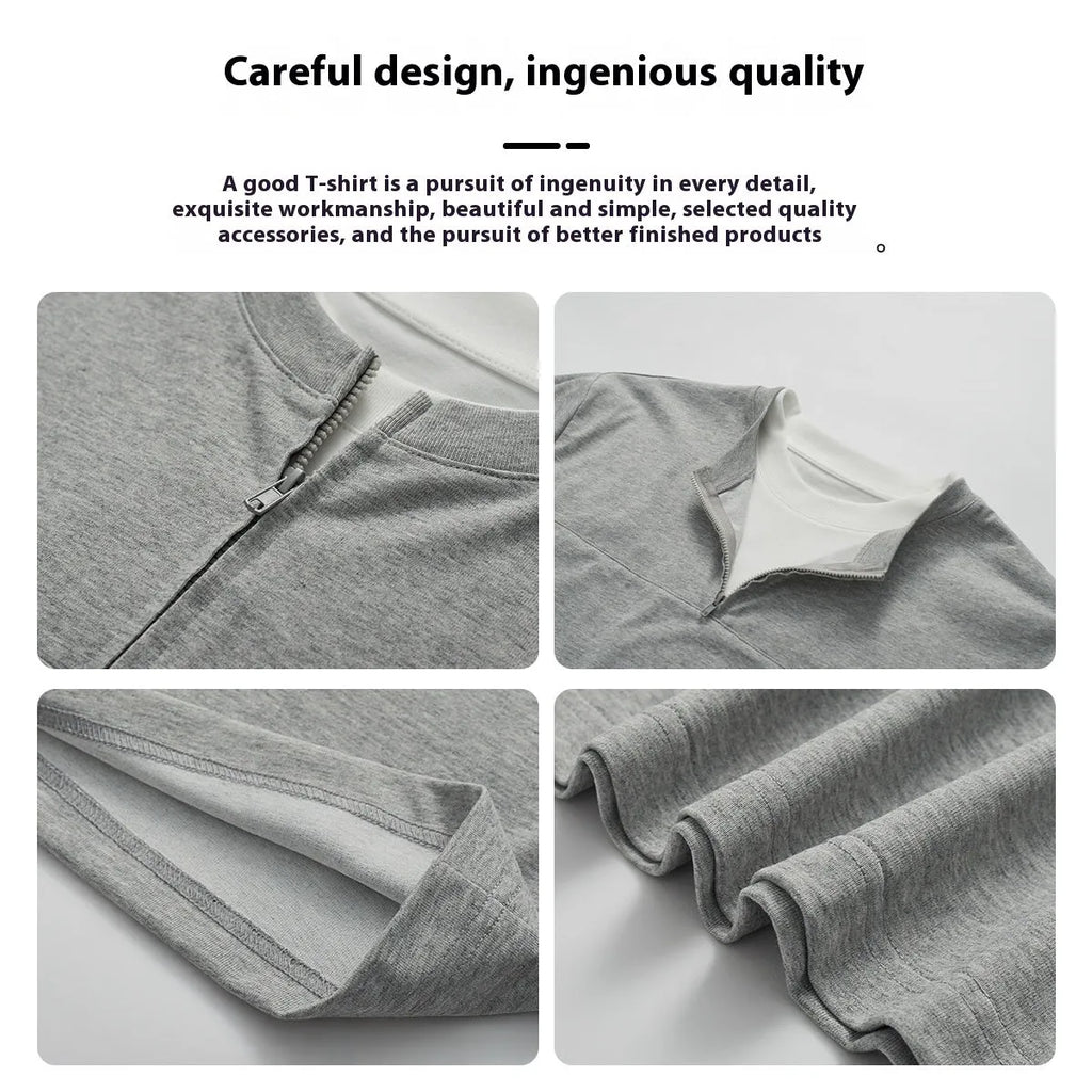Loose blue zip-through patchwork top on a hanger, showing the false two-piece design and collar detail.