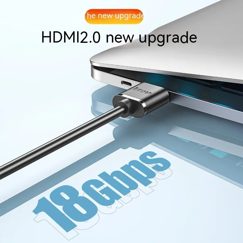Gold-plated HDMI to HDMI cable with thin flexible wire on a white background.