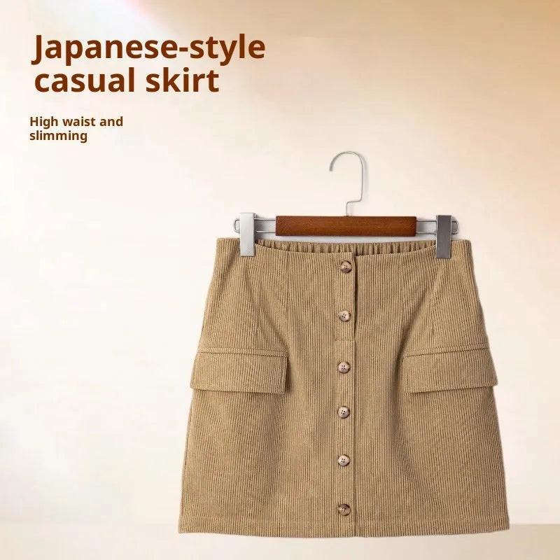 Women's corduroy hip skirt in solid coffee colour, short street-style design with button detail, sizes S to XL