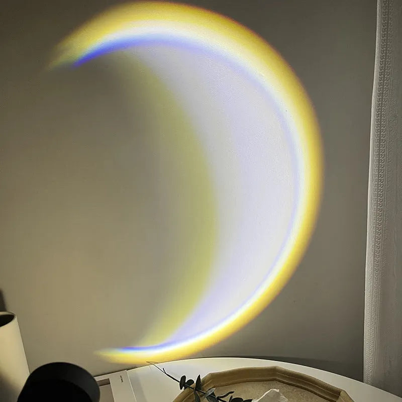 USB-powered moon projector lamp with Scandinavian design projecting rainbow pattern on wall