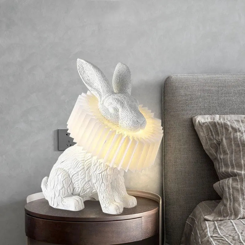 Modern customisable bedside lamp with choice of white or black rabbit silhouette designs.