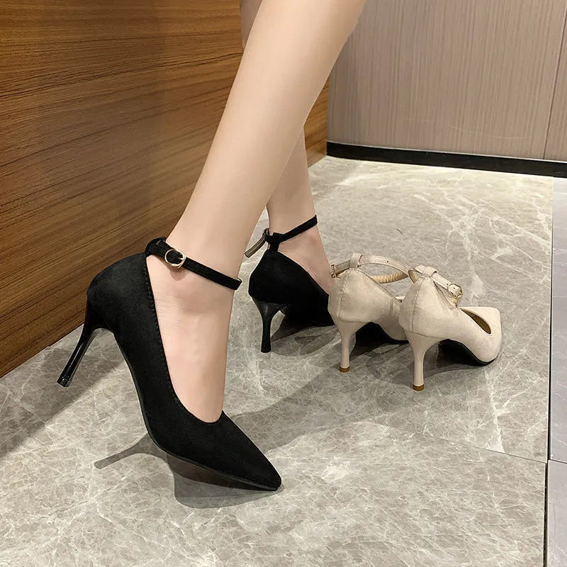 Women's black stiletto heel pump shoes with buckle detail and skull pattern lining