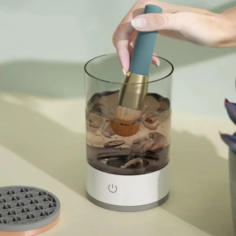 Grey and white electric makeup brush cleaning device with USB charging port
