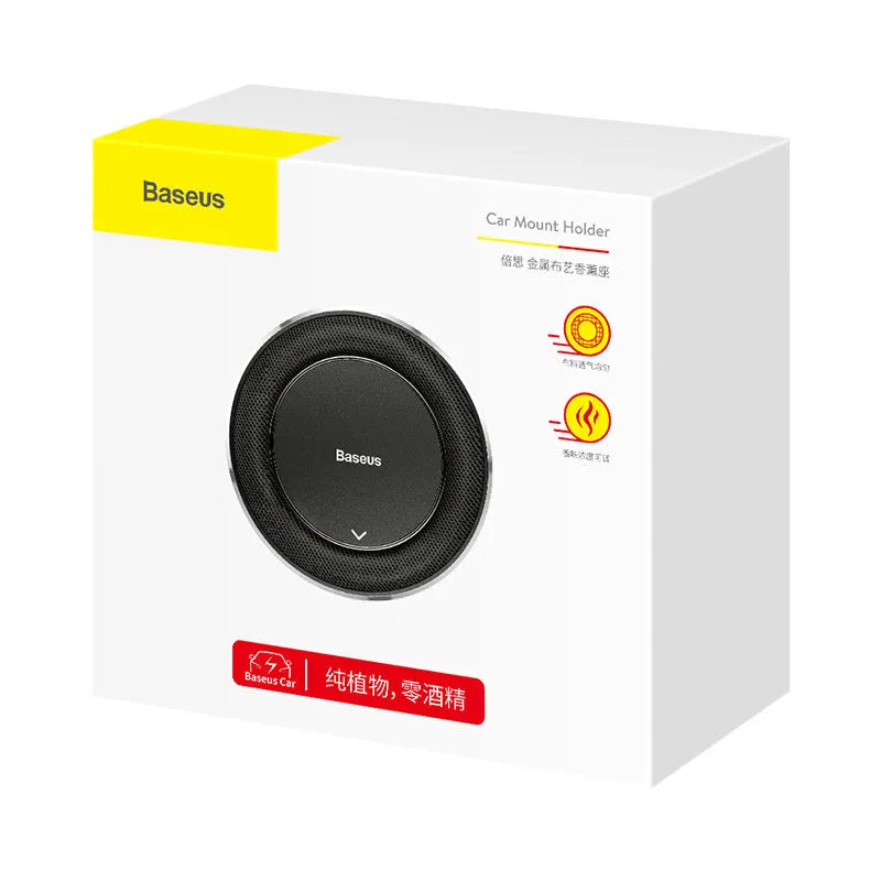 Black aluminium alloy round car perfume seat with aromatherapy tablets on a car seat.