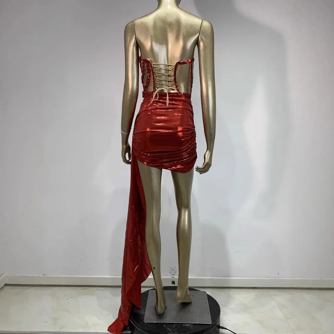 Red women's skirt suit with see-through mesh panels, a stage and party costume in stretch spandex.