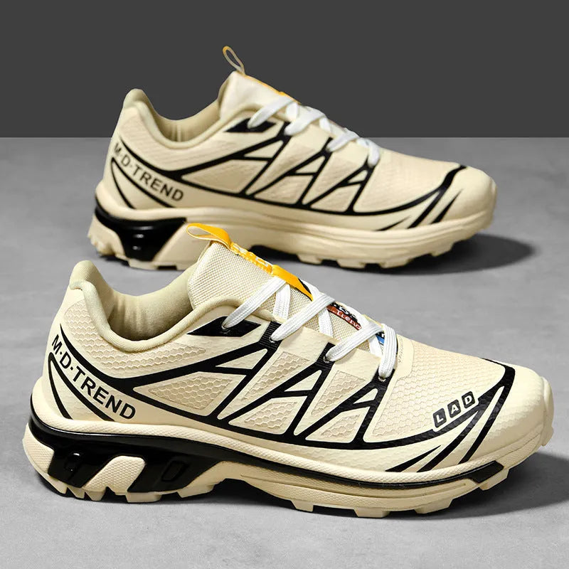 Low-top hiking shoes in artificial leather with mesh lining and rubber sole.