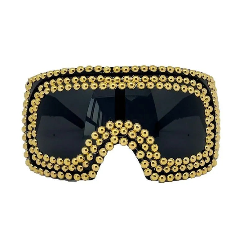 Men's silver square sunglasses with large rim, rivet details on arms, on a plain background.