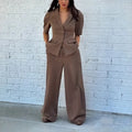 Brown polyester slim fit suit jacket and trousers set on a hanger