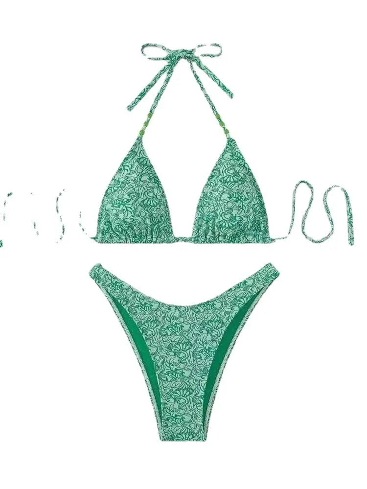 Women's floral bikini halter set with sleeveless top and shorts in polyester fabric.