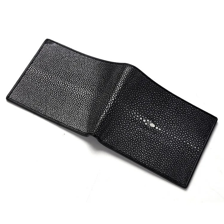 Genuine leather pearl fishskin wallet in horizontal square shape on a plain background