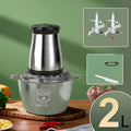 Stainless steel meat grinder with 2L bowl, 2 sets of knives, and adjustable speed control on a kitchen counter