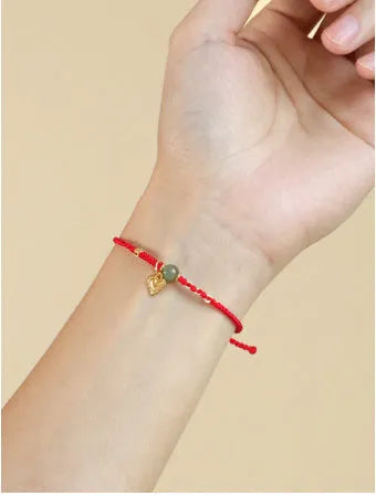 Handmade woven women's bracelet with 925 silver and red Hetian jade beads on adjustable carrying strap