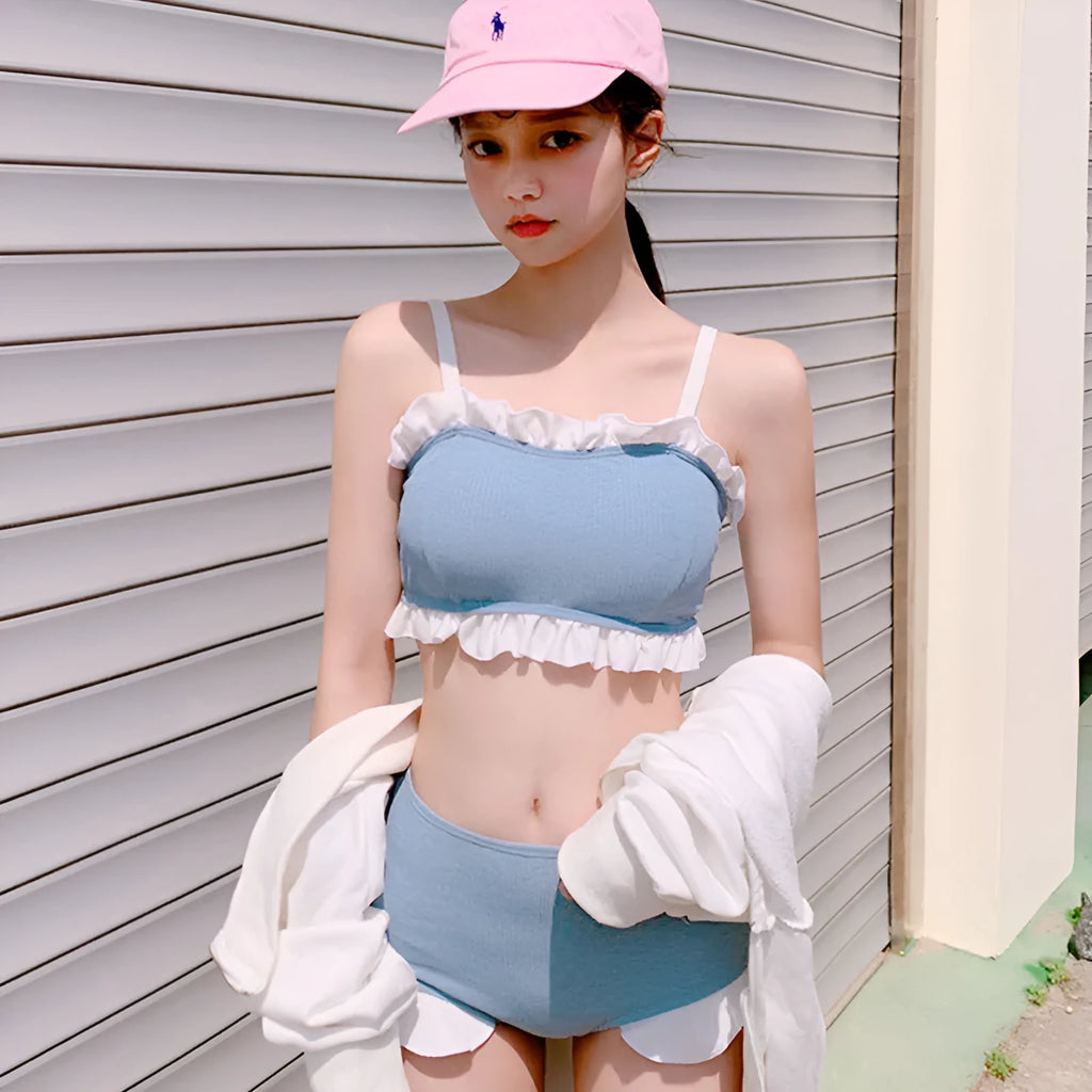 Women's conservative split leg one-piece swimsuit with suspender straps in solid colour
