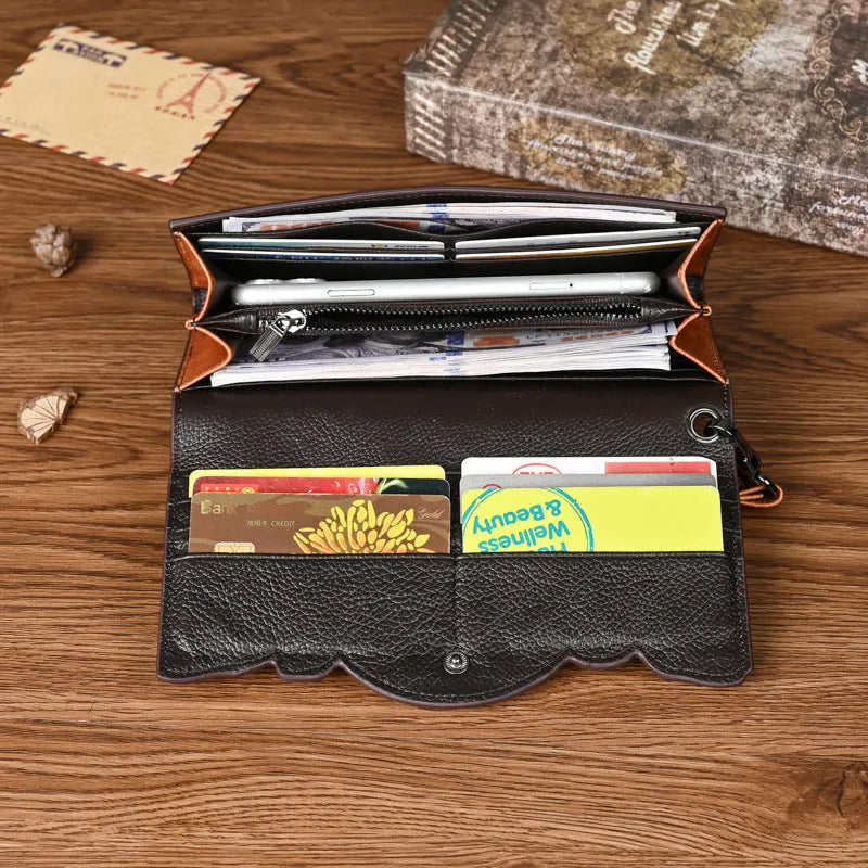 Retro brown tri-fold leather wallet with embossed floral pattern, shown open to reveal multiple card slots and compartments.