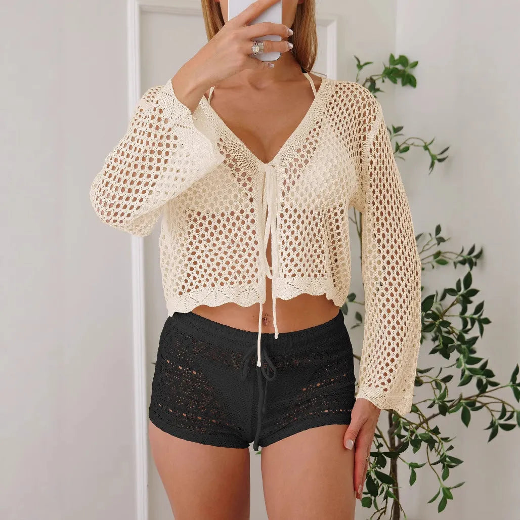 Short apricot women's cardigan blouse with bell sleeves and hollow woven texture.