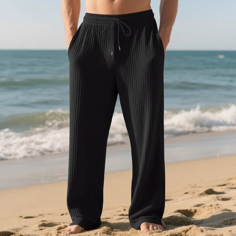 Men's baggy straight trousers in solid colour with drawstring waist, polyester blend fabric, casual style