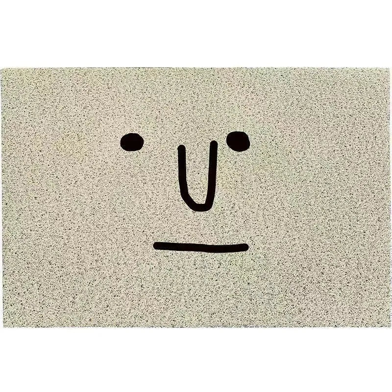 Square PVC floor mat with Mr. Big Nose cartoon face and geometric pattern, shown in available sizes.