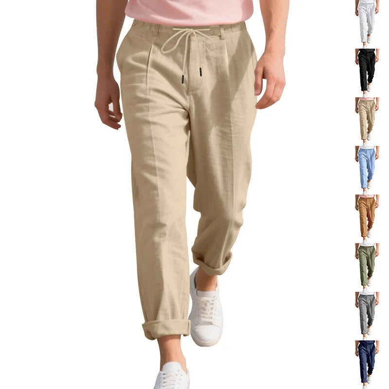 Men's light khaki linen casual trousers with drawstring waist on a hanger.