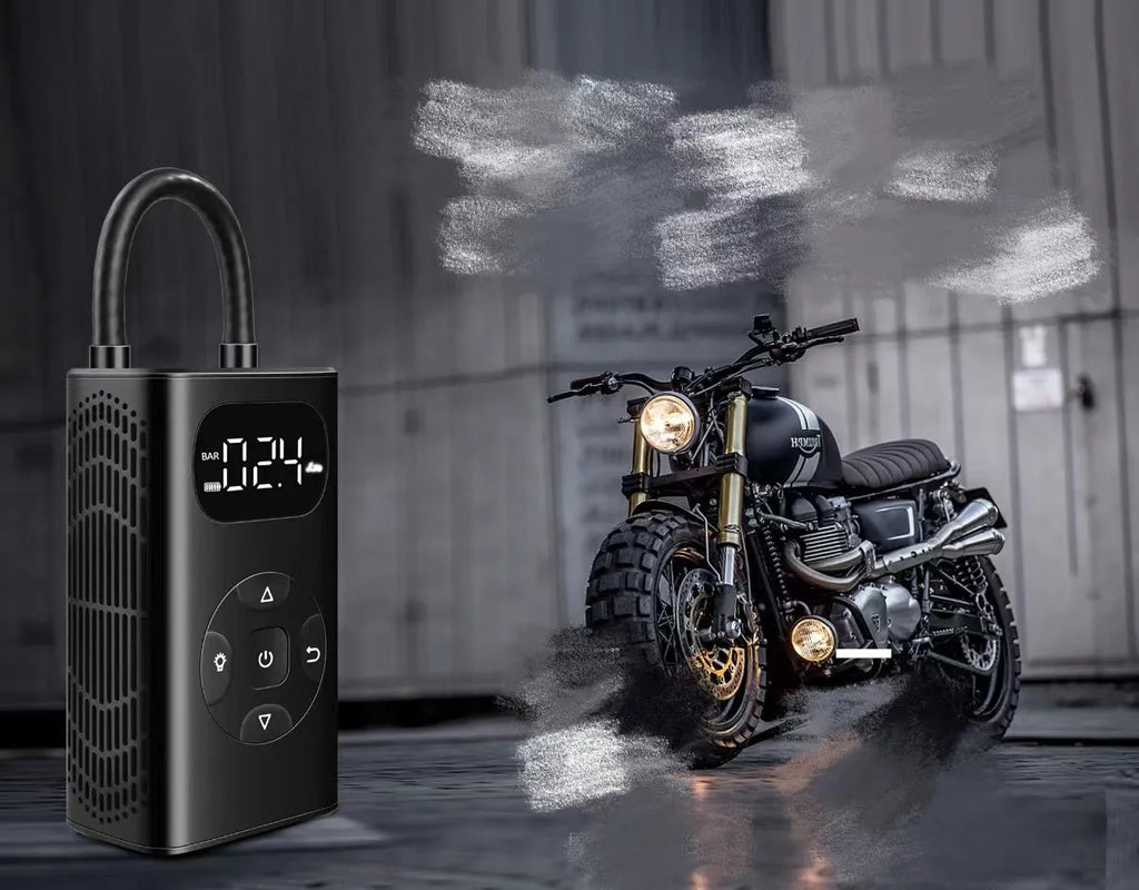 Black portable power bank tyre inflator with USB cable on a grey background.